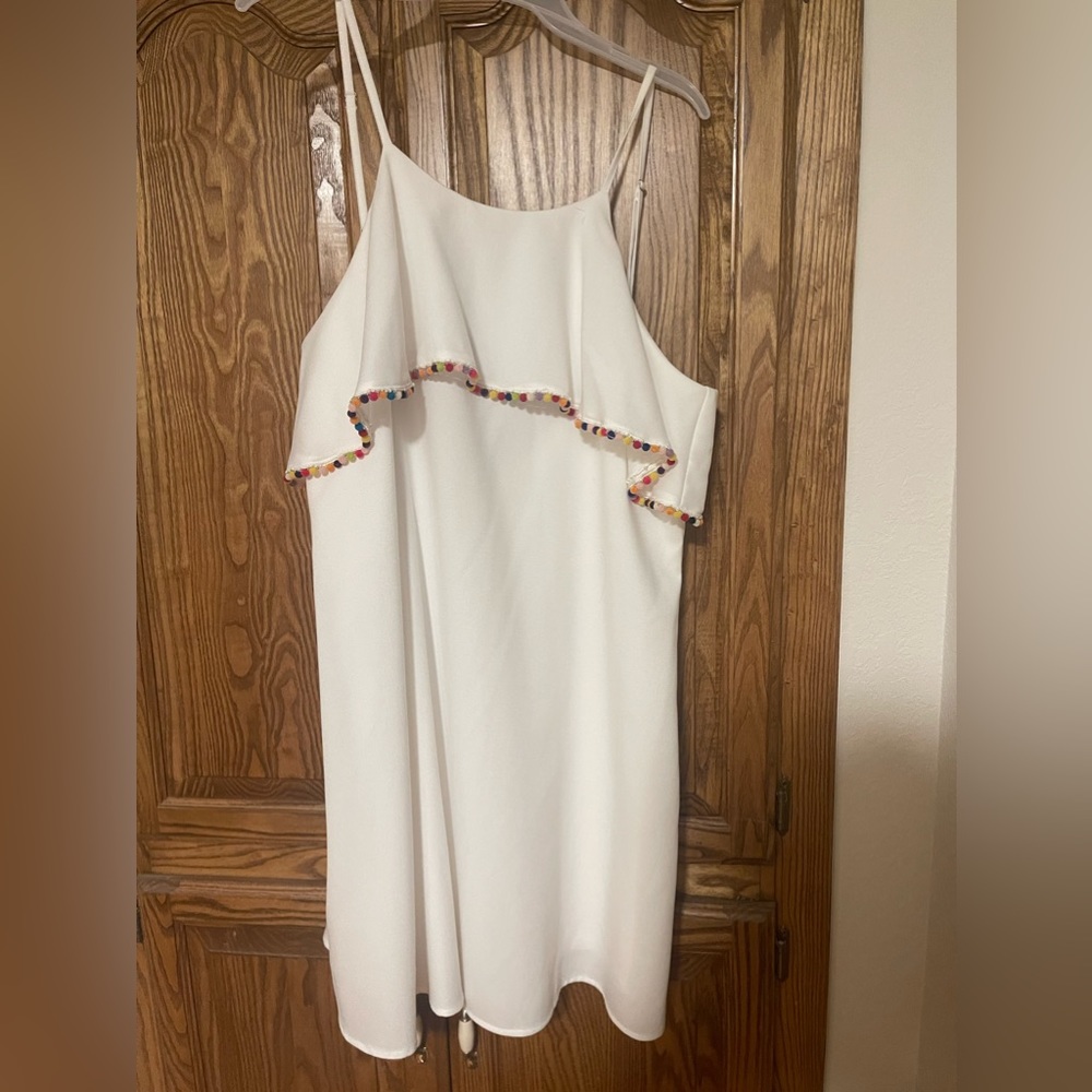 NWT! Love Riche white dress with Pom Pom detail. Size L